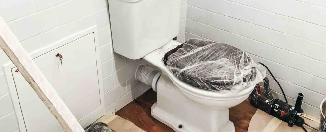 A photo of a bathroom remodel that needs a dumpster rental for clean up.