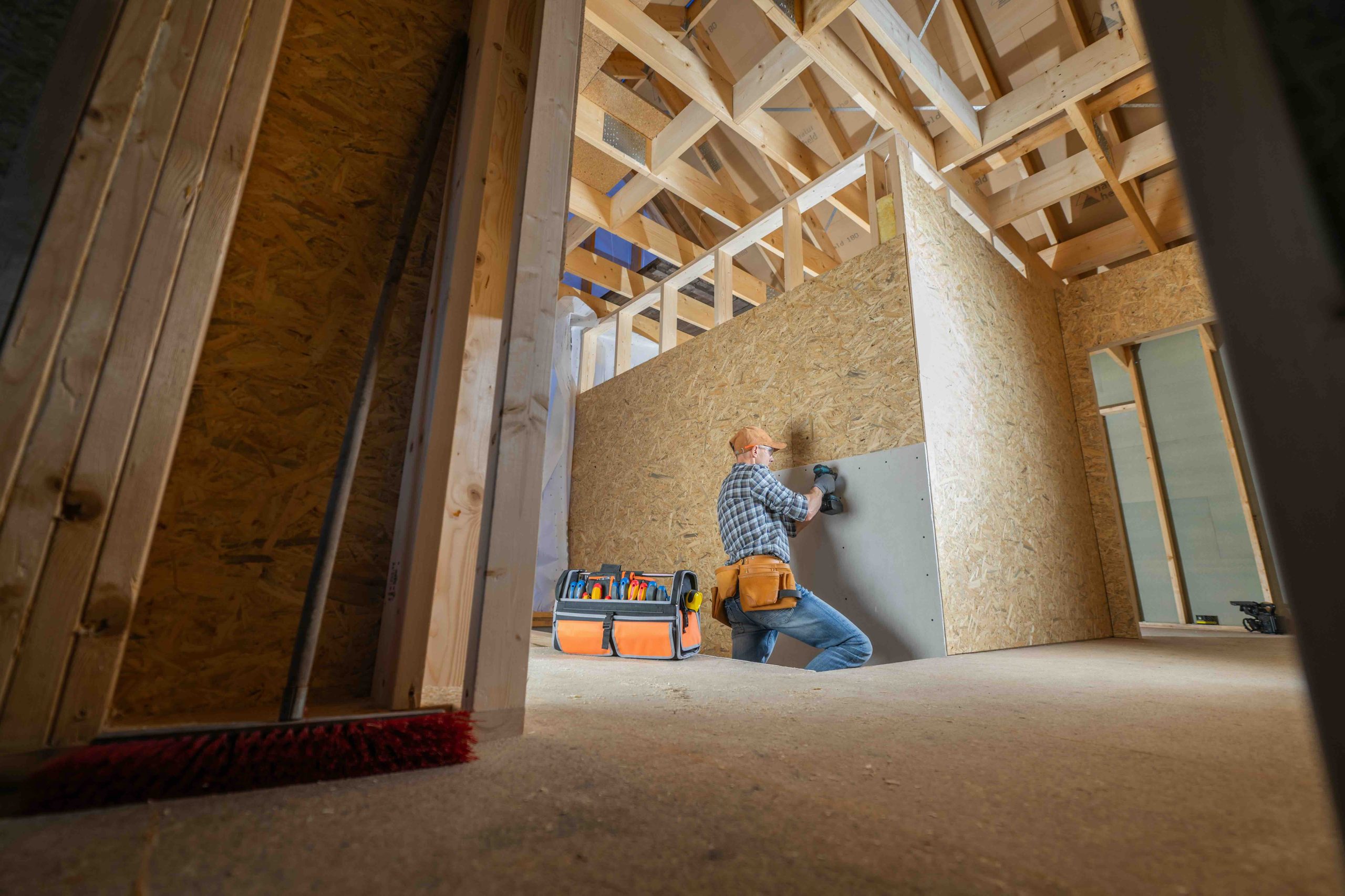 A photo of home builders constructing a new house.
