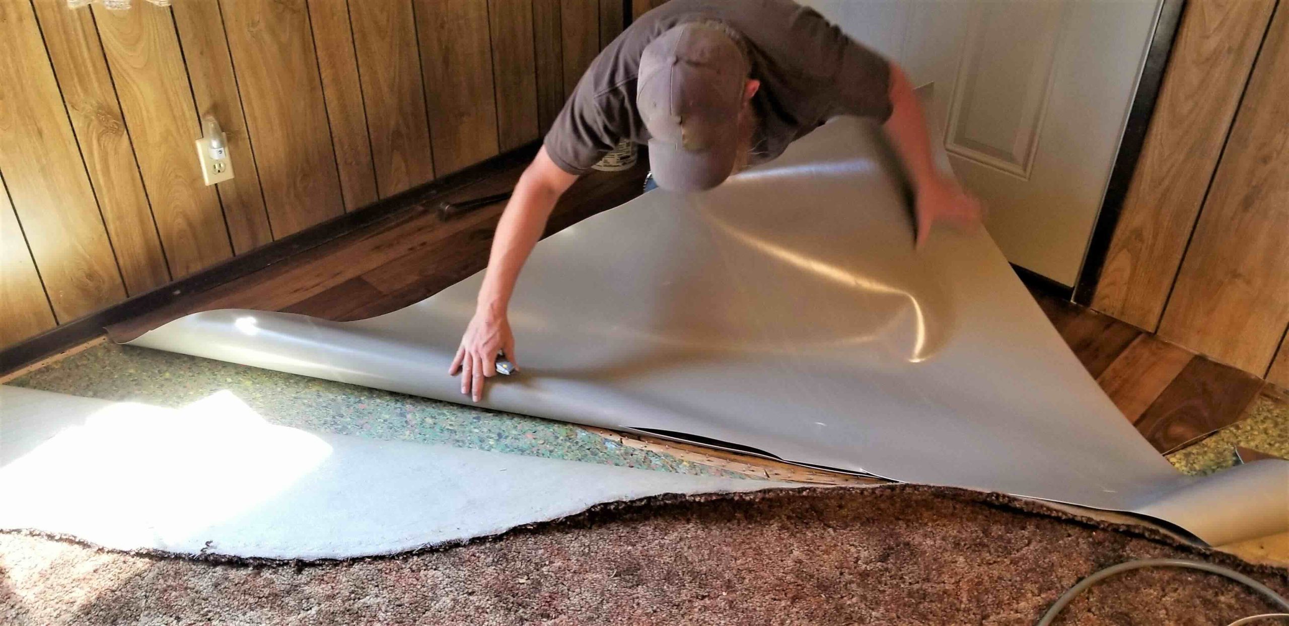 A photo of a DIY carpet removal project that is being completed stress-free.